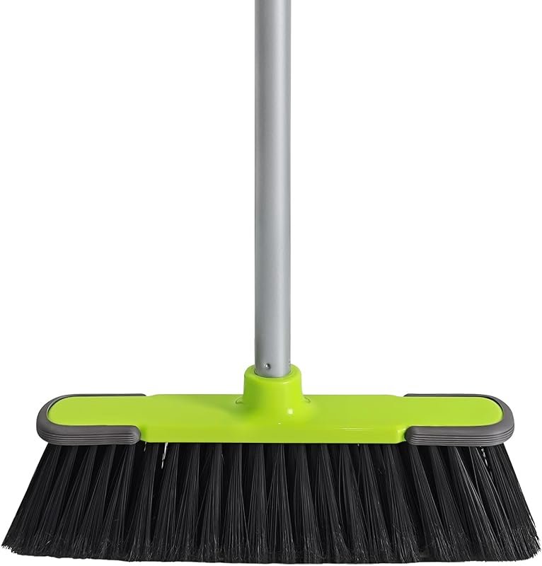 Green indoor broom with 54-inch long handle for sweeping kitchen floor